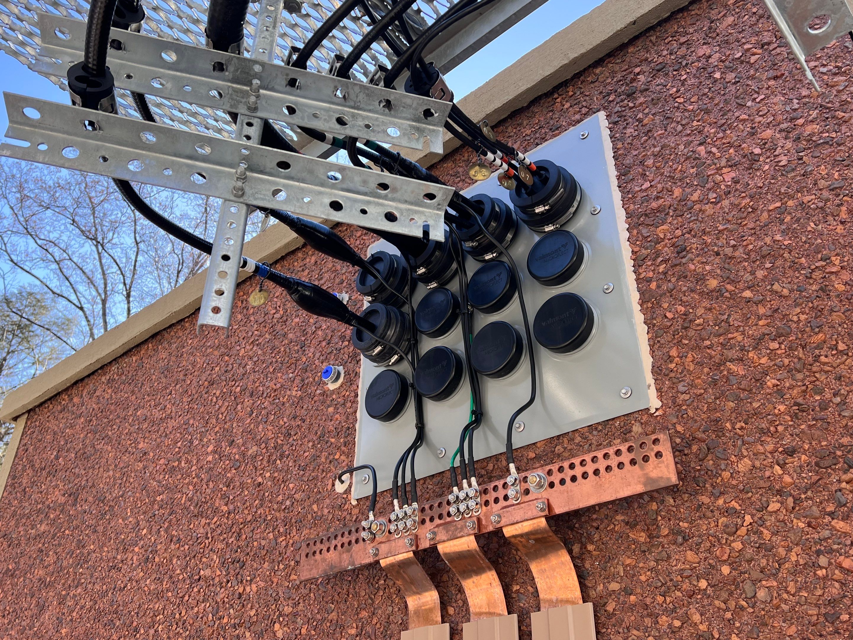 the grounding wire of a radio tower on a wall