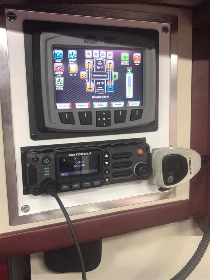 a radio console with a screen and receiver