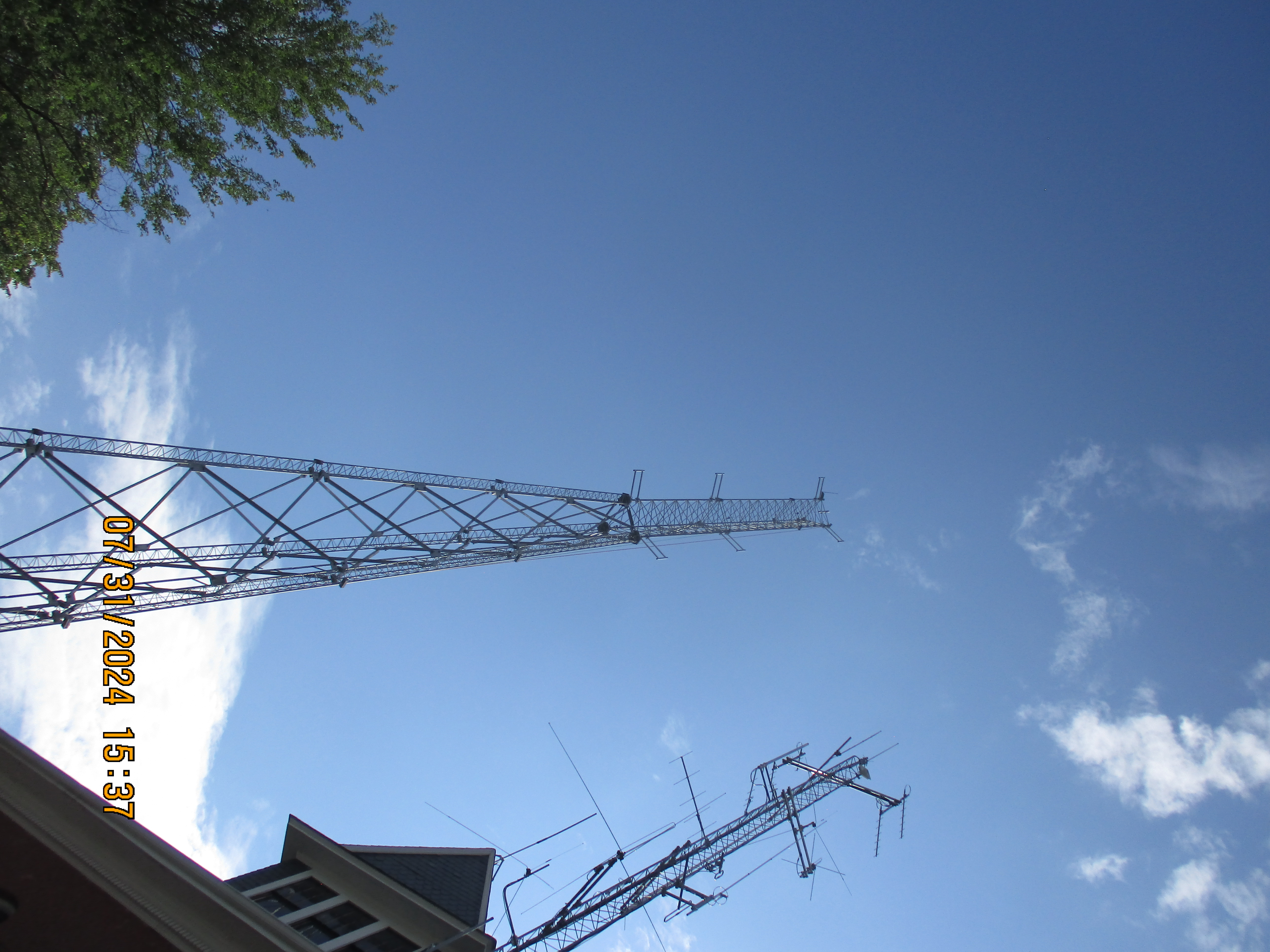 a radio tower at dusk with the date in the lower left corner