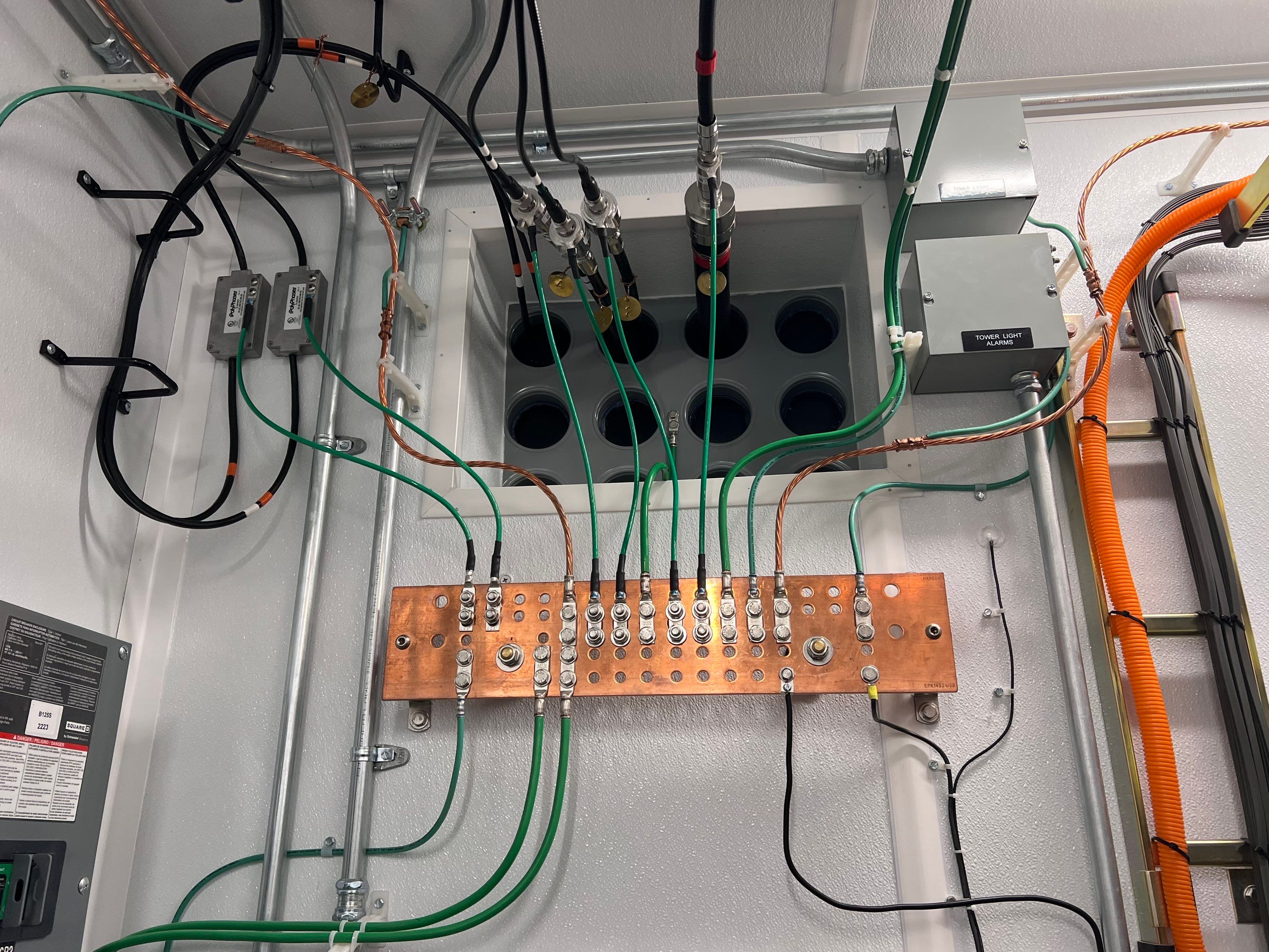 the wires and circuitry of a radio tower