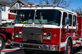 a fire truck driving down a street