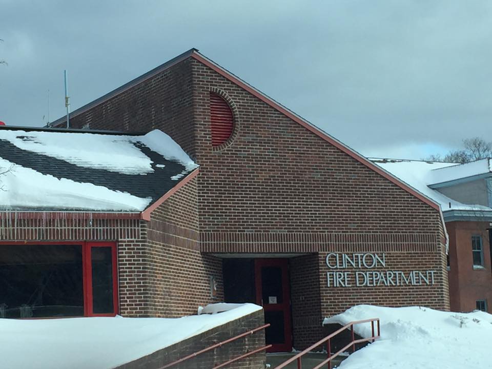 a brick building with the text clinton fire department
